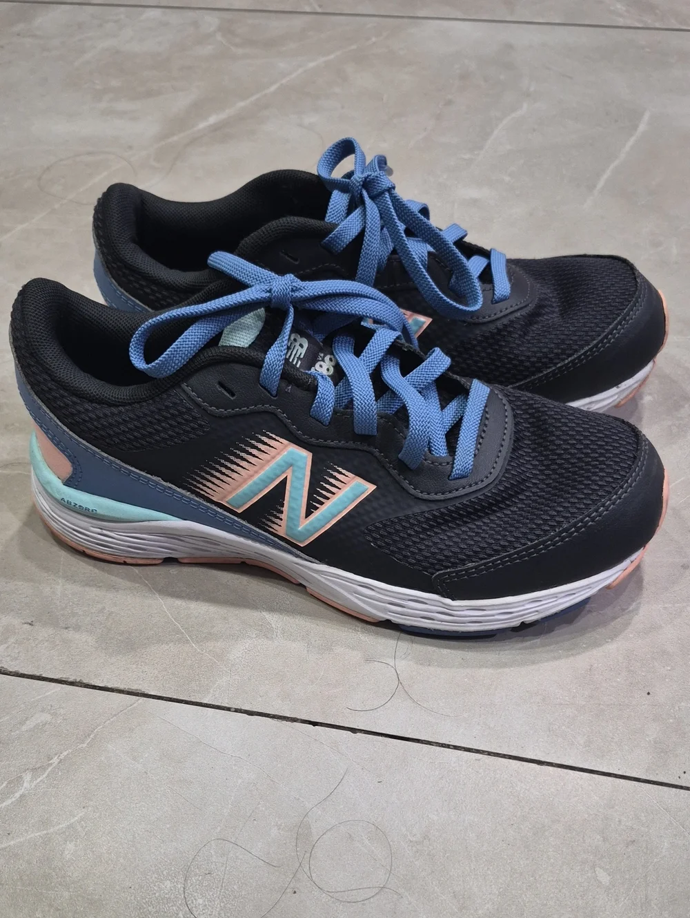 New Balance Women's Black Athletic Sneakers with Blue Laces and Peach Accents
